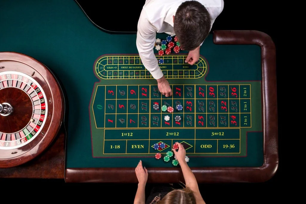 Live Casinos in Singapore: A Thrilling Experience 1 a top down view of a roulette table in a casino wi